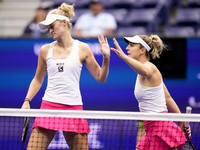 Ottawa's Gabriela Dabrowski and partner Erin Routliffe of New Zealand finished the women's doubles group stage at the WTA Finals with a perfect record after defeating the Czech duo of Katerina Siniakova and Barbora Krejcikova 6-4, 7-5 on Friday. Routliffe, left, high fives Dabrowski, at the U.S. Open tennis championships, Sunday, Sept. 10, 2023, in New York.