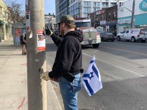 Toronto business displaying images of hostages until Hamas frees them 19 Jewish man says while he gets harrassed putting up posters of the Israeilis kidnapped by Hamas, he just keeps on doing it and won’t stop until they are released — Joe Warmington photo