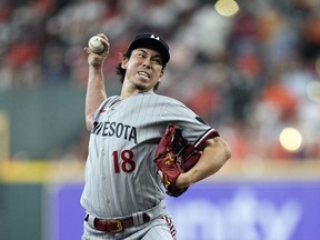 FILE - Minnesota Twins relief pitcher Kenta Maeda throws during the fourth inning in Game 1 of an American League Division Series baseball game against the Houston Astros, Oct. 7, 2023, in Houston. Right-hander Maeda and the Detroit Tigers agreed to a $24 million, two-year contract, a person familiar with the deal told The Associated Press. The person spoke on condition of anonymity Sunday, Nov. 26, 2023, because the agreement was subject to a successful physical and had not been announced.
