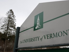 FILE - A sign on the University of Vermont campus in Burlington, Vt., is pictured on March 11, 2020. Police say three young men of Palestinian descent who were attending a Thanksgiving holiday gathering were shot and injured near the University of Vermont campus. Police are searching for the suspect after the three were shot late Saturday, Nov. 25, 2023, in Burlington.