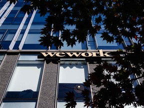 Signage for shared office giant WeWork is seen outside a building in Seoul on Nov. 7, 2023.