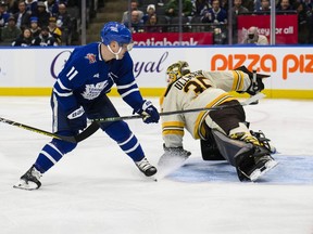 Toronto Maple Leafs centre Max Domi scores on Boston Bruins goaltender Linus Ullmark.