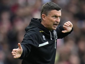 Sheffield United's head coach Paul Heckingbottom gestures during an English Premier League soccer match against Arsenal.