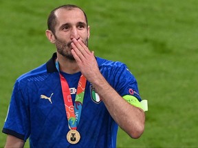 Italian defender Giorgio Chiellini gestures after Italy won the UEFA EURO 2020 final against England.