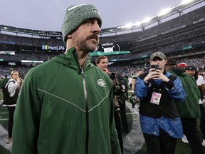 New York Jets quarterback Aaron Rodgers walks off the field after an NFL football game between the New York Jets and the Houston Texans.