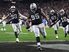 Defensive tackle John Jenkins of the Las Vegas Raiders scores a touchdown against the Los Angeles Chargers.