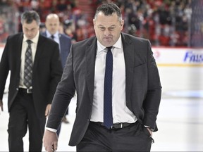 Ottawa Senators head coach D.J. Smith walks across the ice.