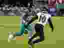 Jacksonville Jaguars quarterback Trevor Lawrence fumbles the ball as Baltimore Ravens cornerback Arthur Maulet (10) closes in.