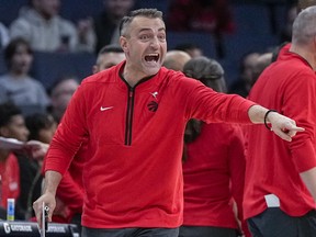 Toronto Raptors head coach Darko Rajakovic yells during the second half of an NBA basketball game against the Charlotte Hornets.