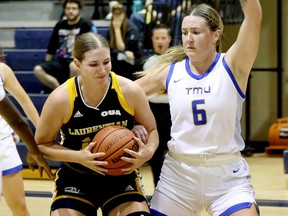 Melanie Cloutier (left) of the Laurentian Voyageurs battles in the paint with Haley Fedick of the TMU Bold earlier this year.