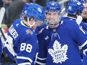 Toronto Maple Leafs' Mitch Marner (right) is congratulated by William Nylander after scoring the shootout winner against the Seattle Kraken.