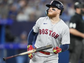 Alex Verdugo of the Boston Red Sox flips his bat.