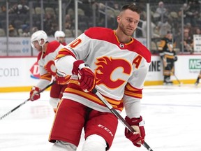 Jonathan Huberdeau of the Calgary Flames skates during warmups prior to a game against the Pittsburgh Penguins at PPG PAINTS Arena on October 14, 2023 in Pittsburgh, Pennsylvania.