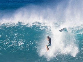 Brazilian pro surfer Joao Chianca wipes out while practicing for the upcoming Vans 2023 Pipeline Masters event.