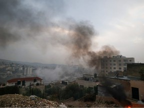 Smoke billows during an Israeli raid