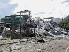 Damaged infrastructure is seen following an explosion at the Providence industrial area in Mahe on December 7, 2023.
