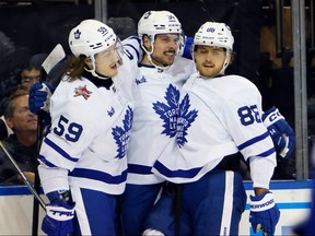 Auston Matthews of the Toronto Maple Leafs celebrates a goal with Tyler Bertuzzi and William Nylander.