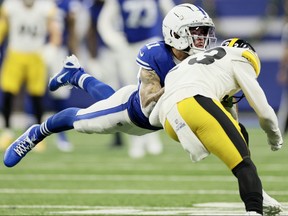 Michael Pittman Jr. of the Indianapolis Colts and Damontae Kazee of the Pittsburgh Steelers collide while going after a ball during the second quarter at Lucas Oil Stadium on Dec. 16, 2023 in Indianapolis, Indiana.