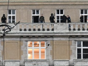 Armed police are seen on the balcony of the Charles University in central Prague, on December 21, 2023 after a mass shooting. (MICHAL CIZEK/AFP via Getty Images)