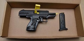 An image from Durham cops of a firearm allegedly seized on Nov. 25, 2023 after a single-vehicle crash in Oshawa.