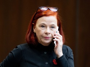 Catherine Tait, president and CEO of the Canadian Broadcasting Corporation (CBC), talks on the phone before appearing at the Standing Committee on Canadian Heritage in Ottawa, on Thursday, Nov. 2, 2023.