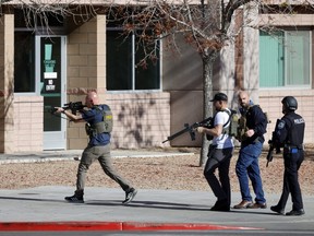 Law enforcement officers head into the University of Nevada, Las Vegas, campus.