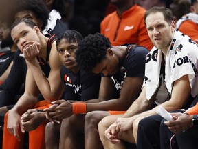 Detroit Pistons forward Kevin Knox II, from left, guard Marcus Sasser, forward Ausar Thompson and forward Bojan Bogdanovic sit on the bench during the fourth quarter of a 118-112 loss to the Brooklyn Nets, an NBA record 27th straight loss, Tuesday, Dec. 26, 2023, in Detroit.