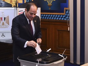 In this photo provided by Egypt's presidency media office, Egyptian President Abdel Fattah el-Sissi, casts his vote for the presidential elections at a polling station, in Cairo, Egypt, Sunday, Dec. 10, 2023.