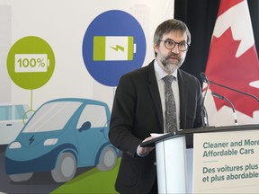 Environment Minister Steven Guilbeault speaks at an announcement in Toronto on Tuesday, Dec.19, 2023, where he outlined the details of his plan to eventually phase out the sale of gas-powered vehicles in Canada.