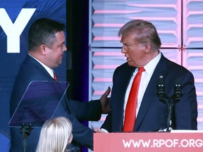 Republican Party of Florida chairman Christian Ziegler greets former president Donald Trump.