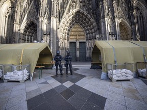 Before the end-of-year pontifical mass in Cologne Cathedral with Cardinal Woelki, the area around the cathedral is heavily guarded by police with machine guns, Sunday, Dec. 31, 2023.
