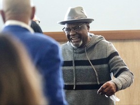 Glynn Simmons reacts after stepping out of the courthouse after Judge Amy Palumbo ruled to approve his "actual innocence" claim during a hearing at the Oklahoma County Courthouse Tuesday, Dec. 19, 2023, in Oklahoma City, Okla.