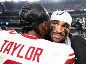 Jalen Hurts of the Philadelphia Eagles greets Tyrod Taylor of the New York Giants after the 33-25 win at Lincoln Financial Field on Dec. 25, 2023 in Philadelphia.