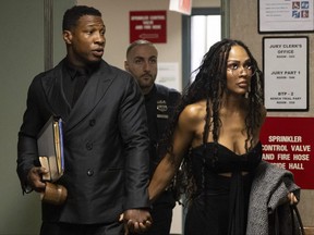 Actors Jonathan Majors and Meagan Good arrive at court for a trial.