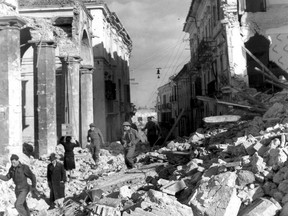 Civilians begin to walk the streets again after the Battle of Ortona. Of a pre-war population of 10,000 some 1,314 were killed in the fighting.