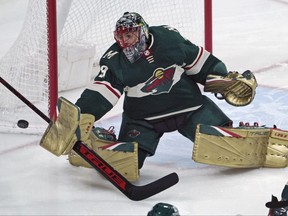 Minnesota Wild goalie Marc-Andre Fleury stops a shot during the first period of the team's NHL hockey game against the Colorado Avalanche, Friday, April 29, 2022, in St. Paul, Minn.