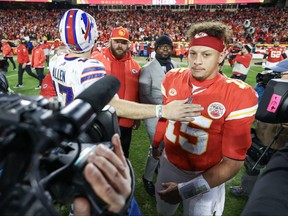 Patrick Mahomes, right, of the Kansas City Chiefs reacts with Josh Allen of the Buffalo Bills after the game at GEHA Field at Arrowhead Stadium on Dec. 10, 2023 in Kansas City, Miss.