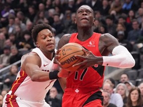 Raptors' Dennis Schroder looks to shoot on the Heat's Kyle Lowry on Wednesday. The Raptors lost 112-103.