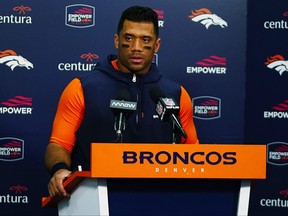 Denver Broncos quarterback Russell Wilson speaks during a news conference after an NFL football game at Empower Field at Mile High, Sunday, Dec. 24, 2023, in Denver.