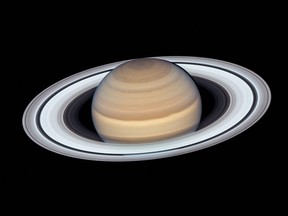 In this file handout photo released by the NASA/European Space Agency's Hubble Telescope, Saturn is seen on June 20, 2019.