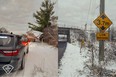 A trucker from Scarborough faces charges after allegedly driving under a low bridge in Brighton and demolishing the trailer he was hauling on Wednesday, Dec. 21, 2023.