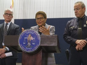Los Angeles Mayor Karen Bass, centre, flanked by District Attorney General of Los Angeles George Gascon and Los Angeles Police Chief Michel Moore, announces the arrest of a suspect in three recent killings of homeless men.