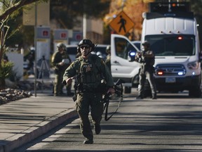A police officer works the scene of a shooting on the University of Nevada, Las Vegas campus