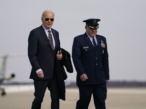 President Joe Biden walks to board Air Force One for a trip to Boston to attend campaign fundraisers, Tuesday, Dec. 5, 2023, in Andrews Air Force Base, Md.