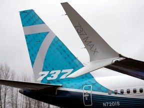 FILE- In this Feb. 5, 2018, file photo, a dual-tipped wing tip, known as a "winglet," stands in view of the tail of a Boeing 737 MAX 7, the newest version of Boeing's fastest-selling airplane, while displayed during a debut for employees and media of the new jet in Renton, Wash. Boeing is asking airlines to inspect its 737 Max jets for a potential loose bolt in the rudder control system, the airplane maker and Federal Aviation Administration confirmed this week, Friday, Dec. 29, 2023.