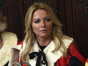 FILE - Baroness Michelle Mone looks on ahead of the State Opening of Parliament by Queen Elizabeth II, in the House of Lords at the Palace of Westminster in London, June 21, 2017. A member of Britain's House of Lords has acknowledged that she repeatedly lied about her links to a company that was awarded lucrative government contracts to supply protective masks and gowns during the coronavirus pandemic. Underwear tycoon Michelle Mone said she had made an "error" in denying connections to the company PPE Medpro and regretted threatening to sue journalists who alleged she had ties to the firm.