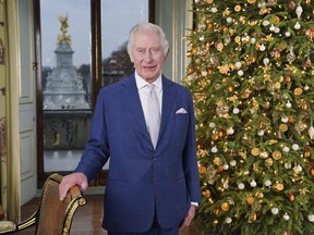 Britain's King Charles III poses for a photo, during the recording of his Christmas message at Buckingham Palace, in London, Saturday, Dec. 7, 2023.