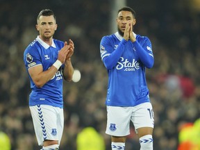 Everton's Jack Harrison and his teammate Arnaut Danjuma cheer supporters at the end of the English Premier League soccer match between Everton and Manchester United, at Goodison Park Stadium, in Liverpool, England, Sunday , Nov. 26, 2023.