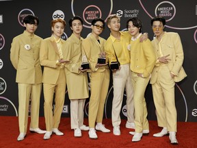 BTS pose in the press room during the 2021 American Music Awards