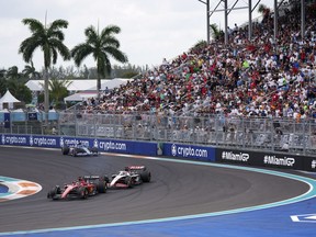FILE - Charles Leclerc leads Kevin Magnussen and Esteban Ocon during the Formula One Miami Grand Prix auto race at the Miami International Autodrome, Sunday, May 7, 2023, in Miami Gardens, Fla. Miami and Shanghai will host their first Formula One sprint races next season as two of the six sprints on the calendar take place in the United States. The calendar published Tuesday includes the first sprint race of the season in April at the Chinese Grand Prix.